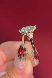 marquise yellow gold engagement ring with pear side stones