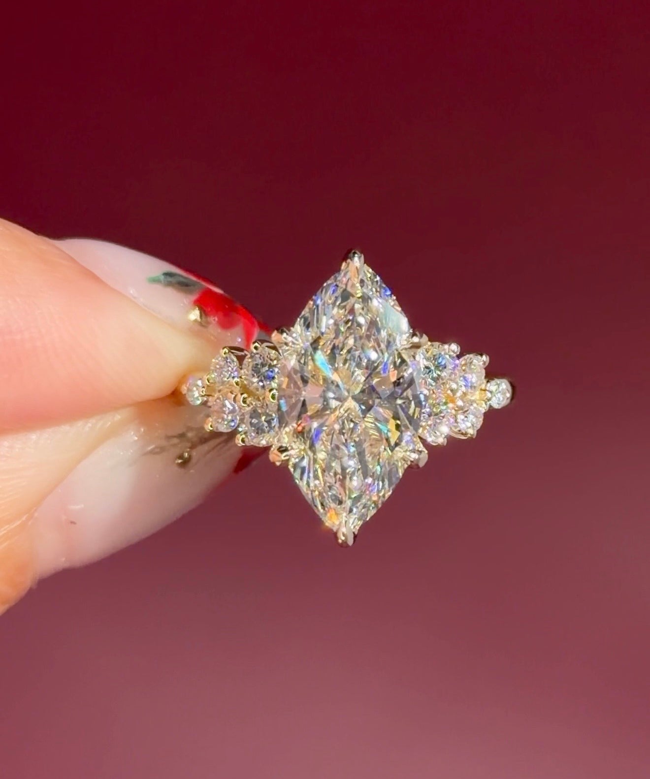 marquise lab diamond engagement ring yellow gold cluster side stones setting