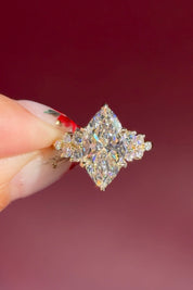 marquise lab diamond engagement ring yellow gold cluster side stones setting