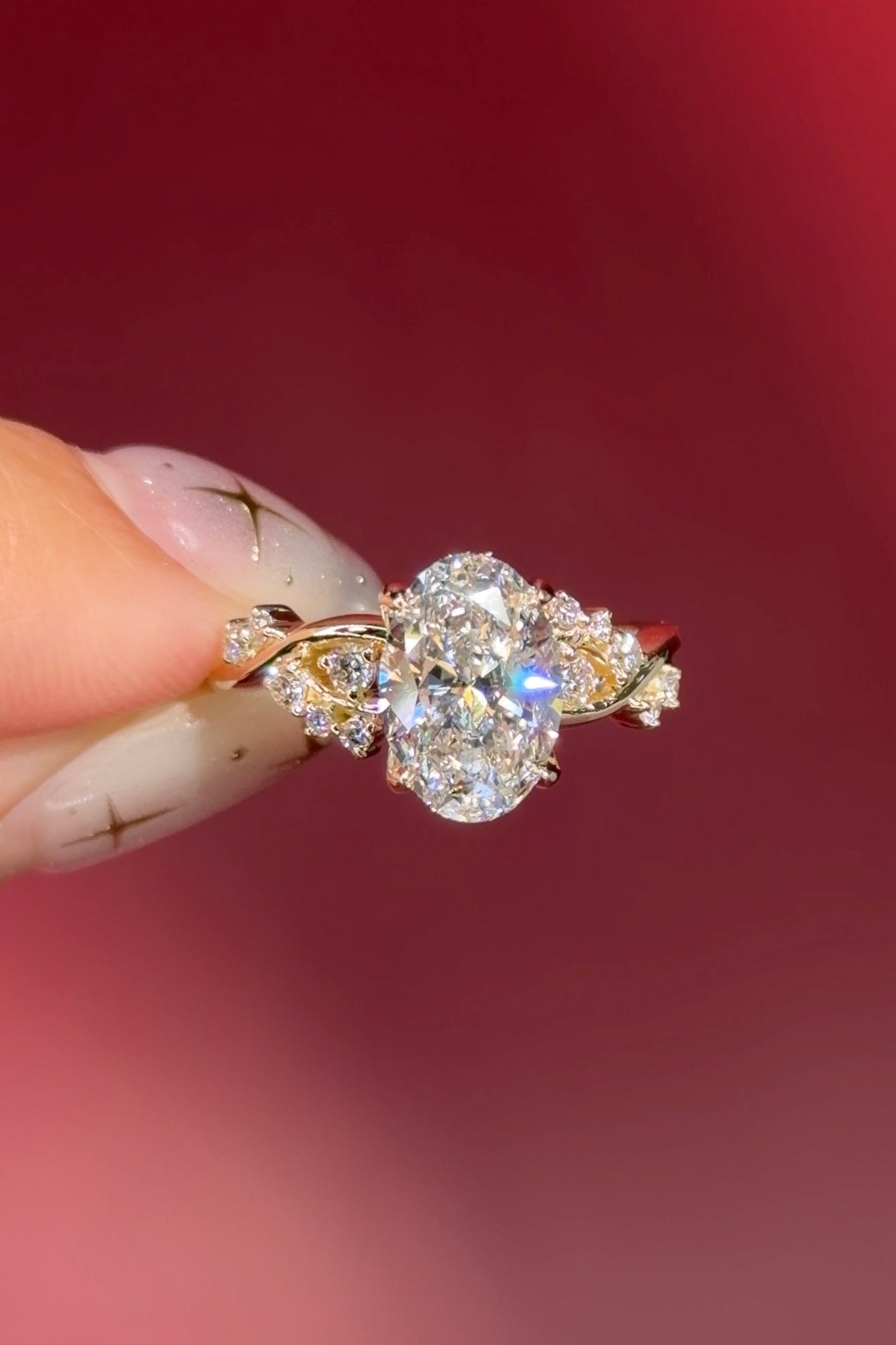 oval lab diamond cluster side stones whimsical yellow gold engagement ring