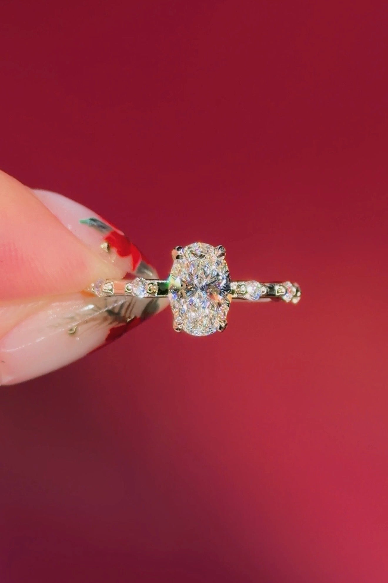 oval floating diamond spaced out band yellow gold engagement ring