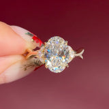 oval lab diamond nature inspired twist band engagement ring yellow gold cluster side stone setting