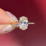 oval lab diamond yellow gold high polish engagement ring with cathedral and hidden halo