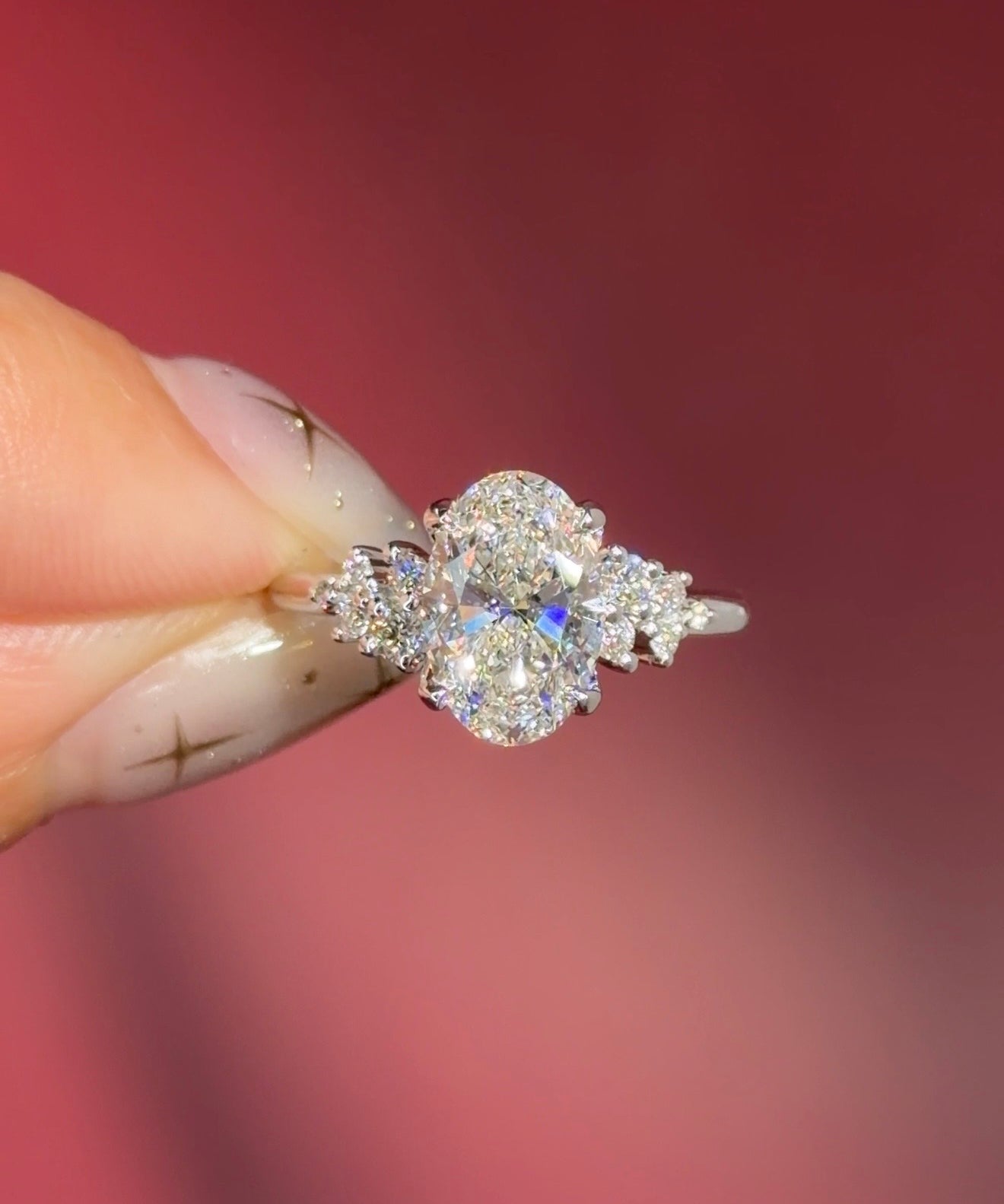 oval lab diamond engagement ring white gold side stones nature inspired cluster style