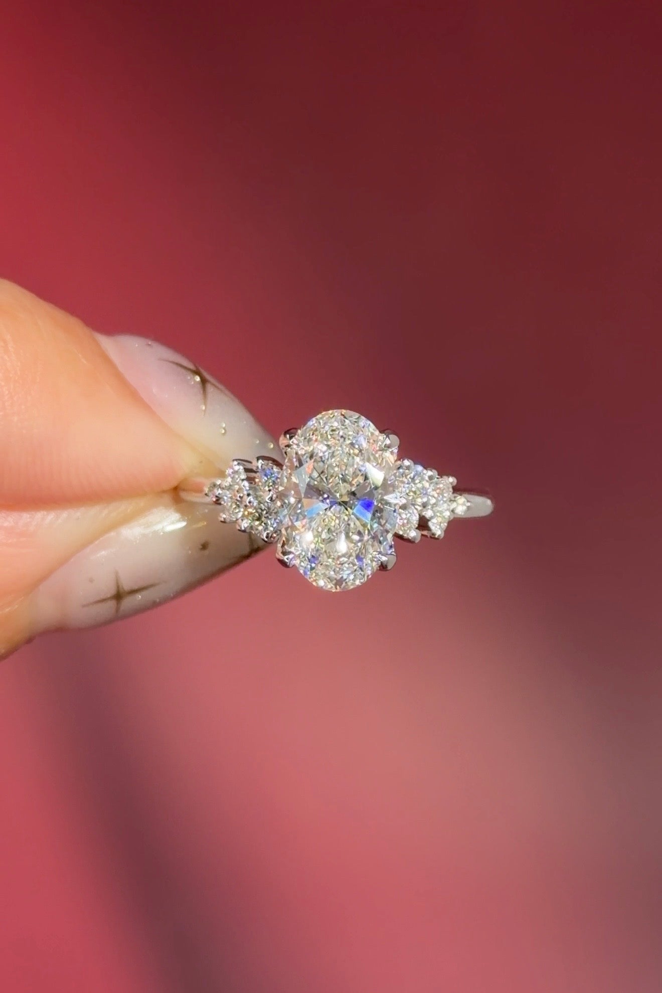 oval lab diamond engagement ring white gold side stones nature inspired cluster style