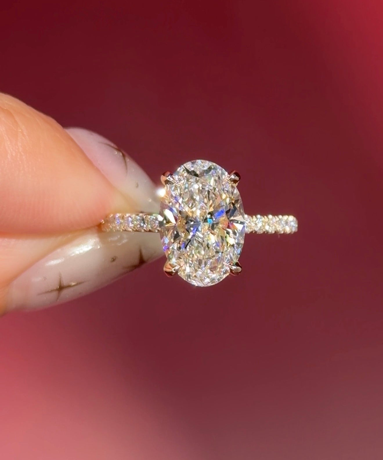 oval lab diamond engagement ring pavé band with diamond prongs and hidden halo