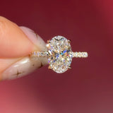 oval lab diamond engagement ring pavé band with diamond prongs and hidden halo