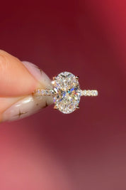 oval lab diamond engagement ring pavé band with diamond prongs and hidden halo