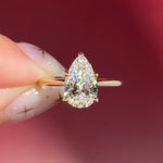 pear lab diamond solitaire engagement ring with cathedral and belt