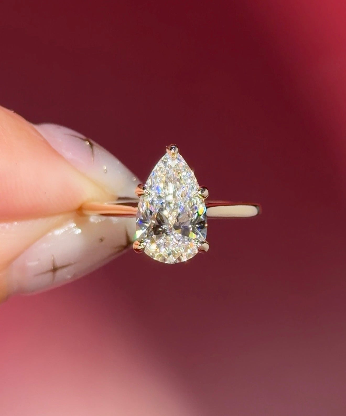 pear lab diamond solitaire engagement ring with cathedral and belt