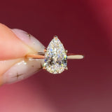 pear lab diamond solitaire engagement ring with cathedral and belt