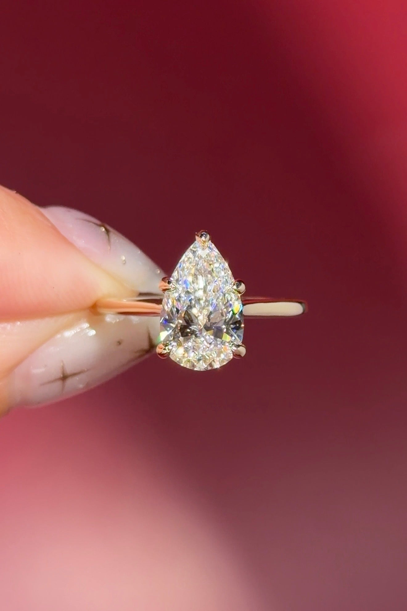 pear lab diamond solitaire engagement ring with cathedral and belt