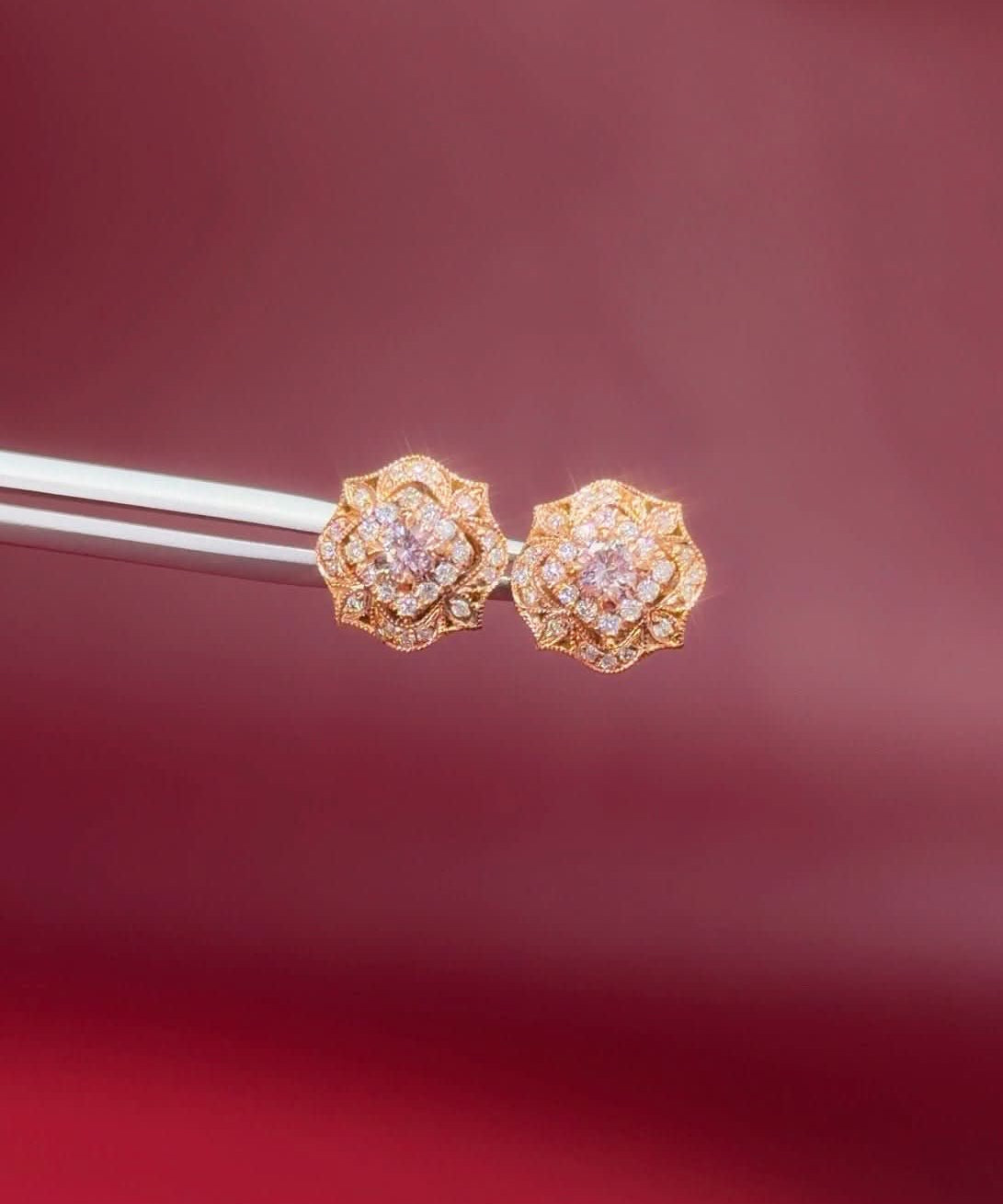 Pink Diamond Claire stud earrings in 14k rose gold with natural pink diamonds and a white diamond halo at Princess Bride Diamonds jewelry store in Orange County