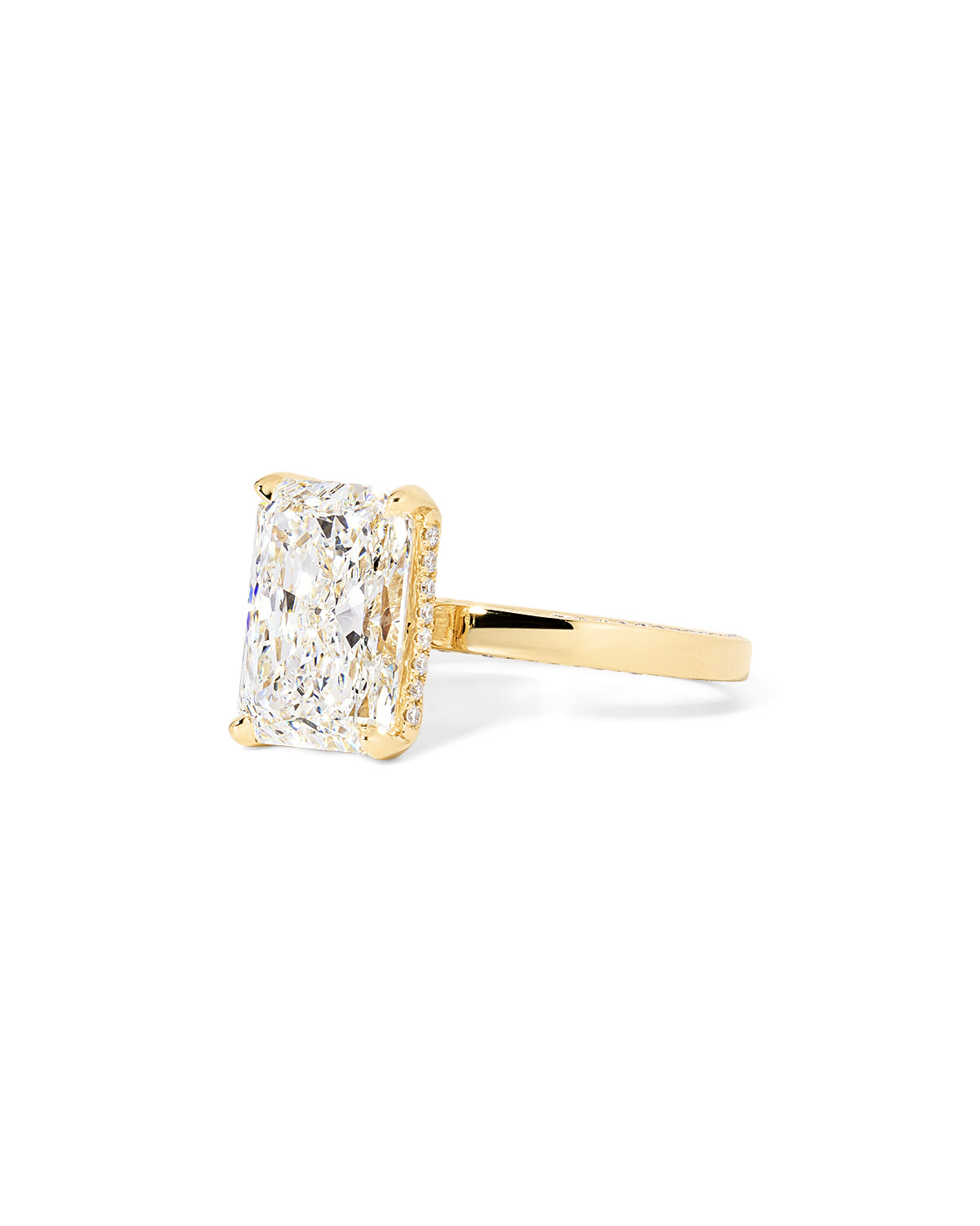 Remi radiant-cut lab grown diamond engagement ring in yellow gold with hidden diamonds on the band and a diamond hidden halo at Princess Bride Diamonds, Huntington Beach, California. 