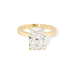 Remi radiant-cut lab grown diamond engagement ring in yellow gold with hidden diamonds on the band and a diamond hidden halo at Princess Bride Diamonds, Huntington Beach, California. 