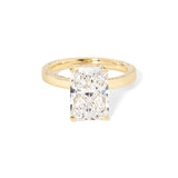 Remi radiant-cut lab grown diamond engagement ring in yellow gold with hidden diamonds on the band and a diamond hidden halo at Princess Bride Diamonds, Huntington Beach, California. 