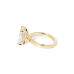 Remi radiant-cut lab grown diamond engagement ring in yellow gold with hidden diamonds on the band and a diamond hidden halo at Princess Bride Diamonds, Huntington Beach, California. 