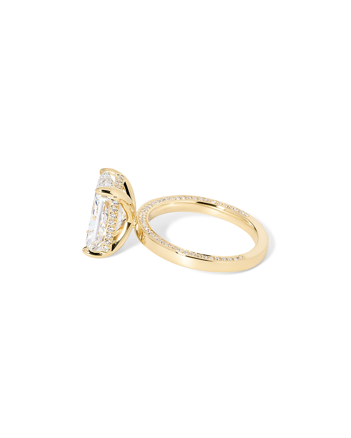 Remi radiant-cut lab grown diamond engagement ring in yellow gold with hidden diamonds on the band and a diamond hidden halo at Princess Bride Diamonds, Huntington Beach, California. 