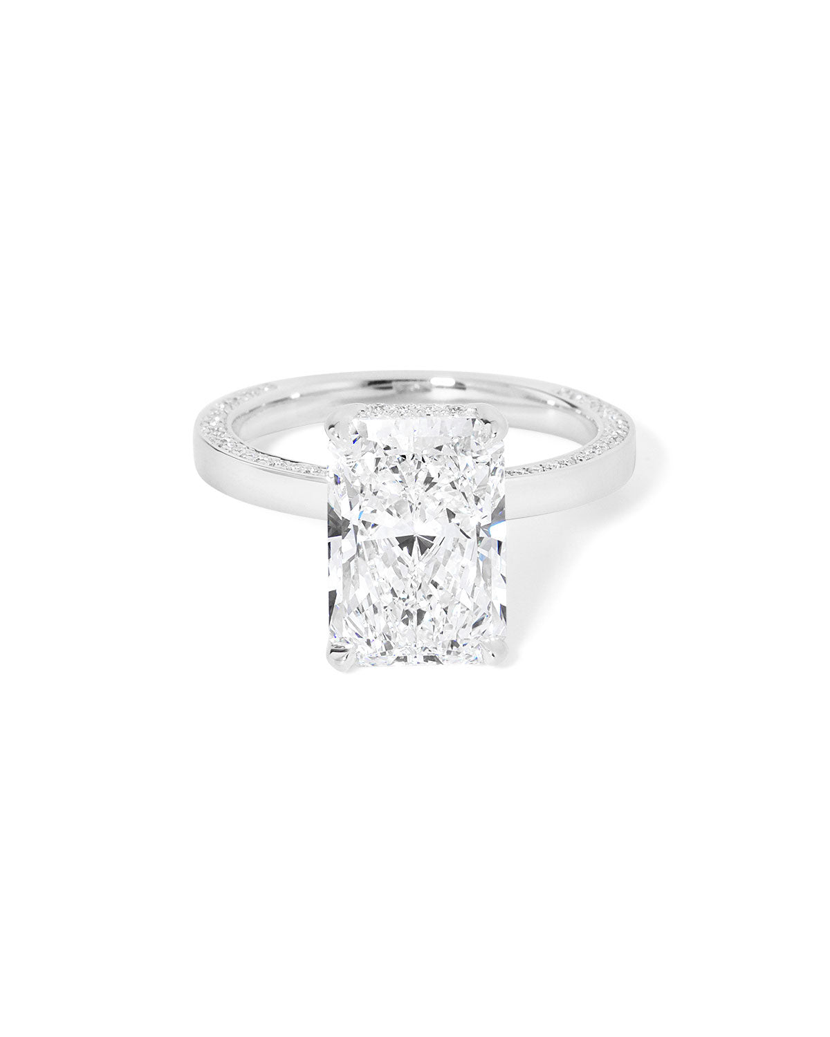 Remi radiant-cut lab grown diamond engagement ring in white gold with hidden diamonds on the band and a diamond hidden halo at Princess Bride Diamonds, Huntington Beach, California. 