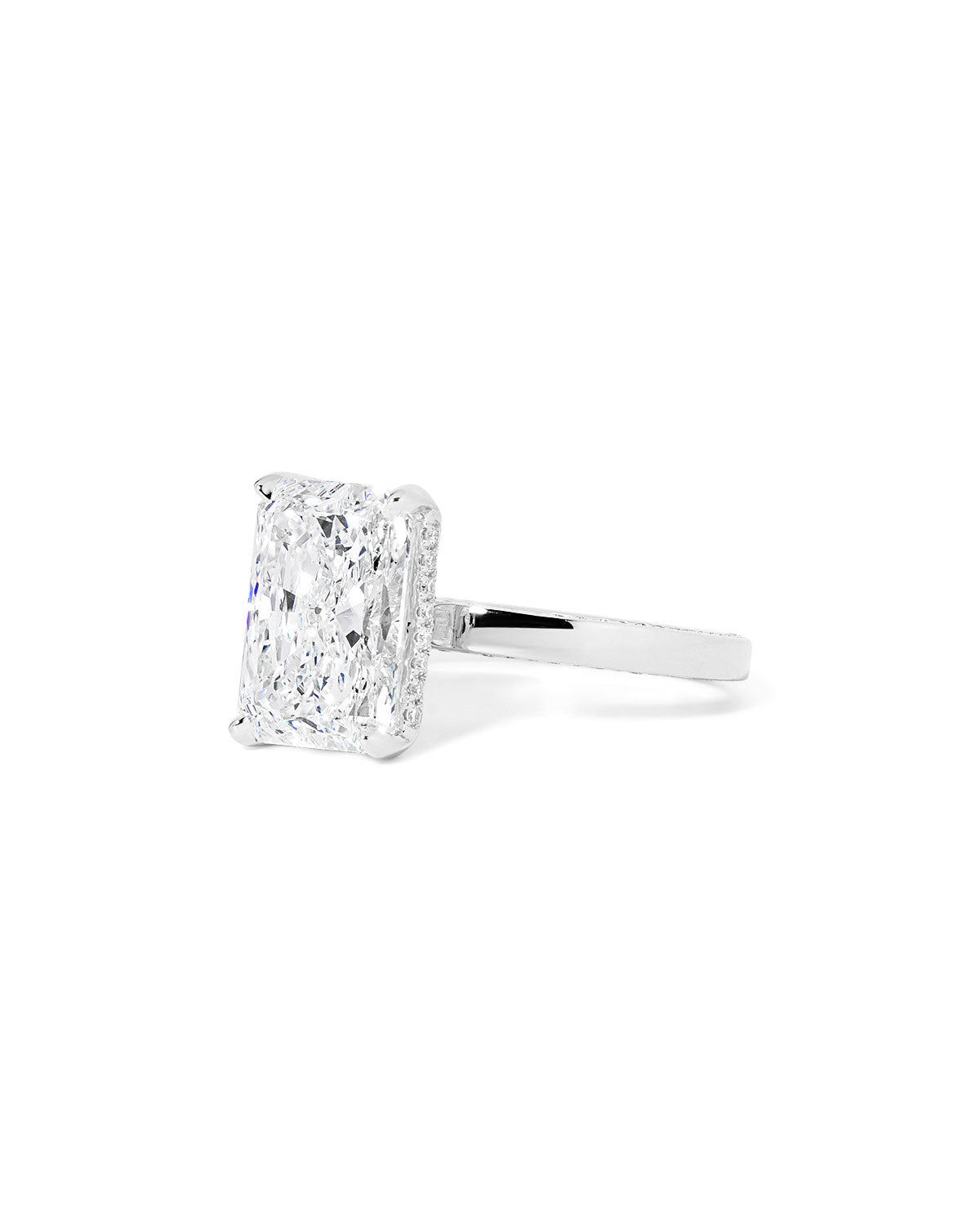 Remi radiant-cut lab grown diamond engagement ring in white gold with hidden diamonds on the band and a diamond hidden halo at Princess Bride Diamonds, Huntington Beach, California. 