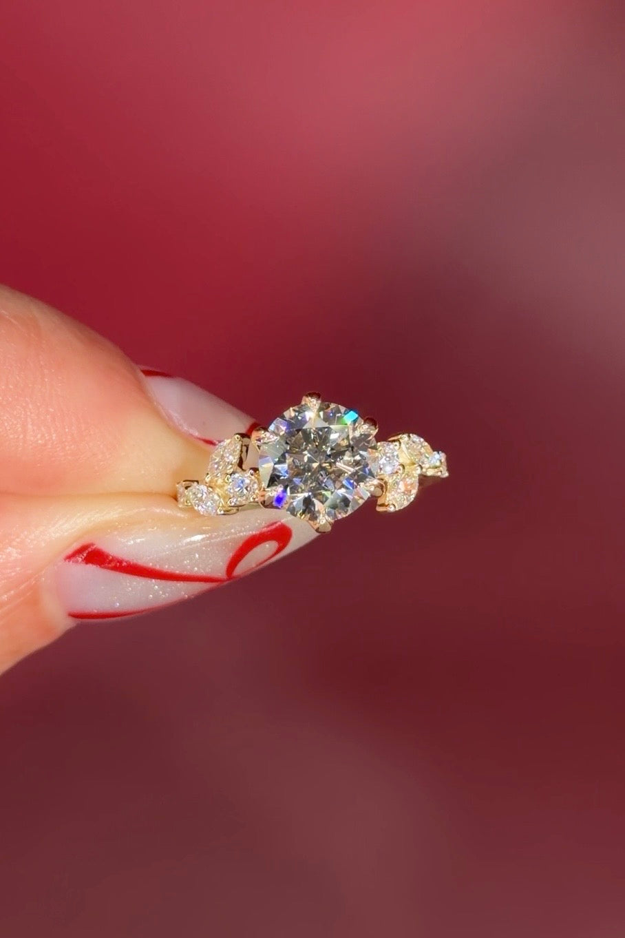 Round Diamond Engagement Ring with Nature Inspired Marquise side diamonds and petal prongs