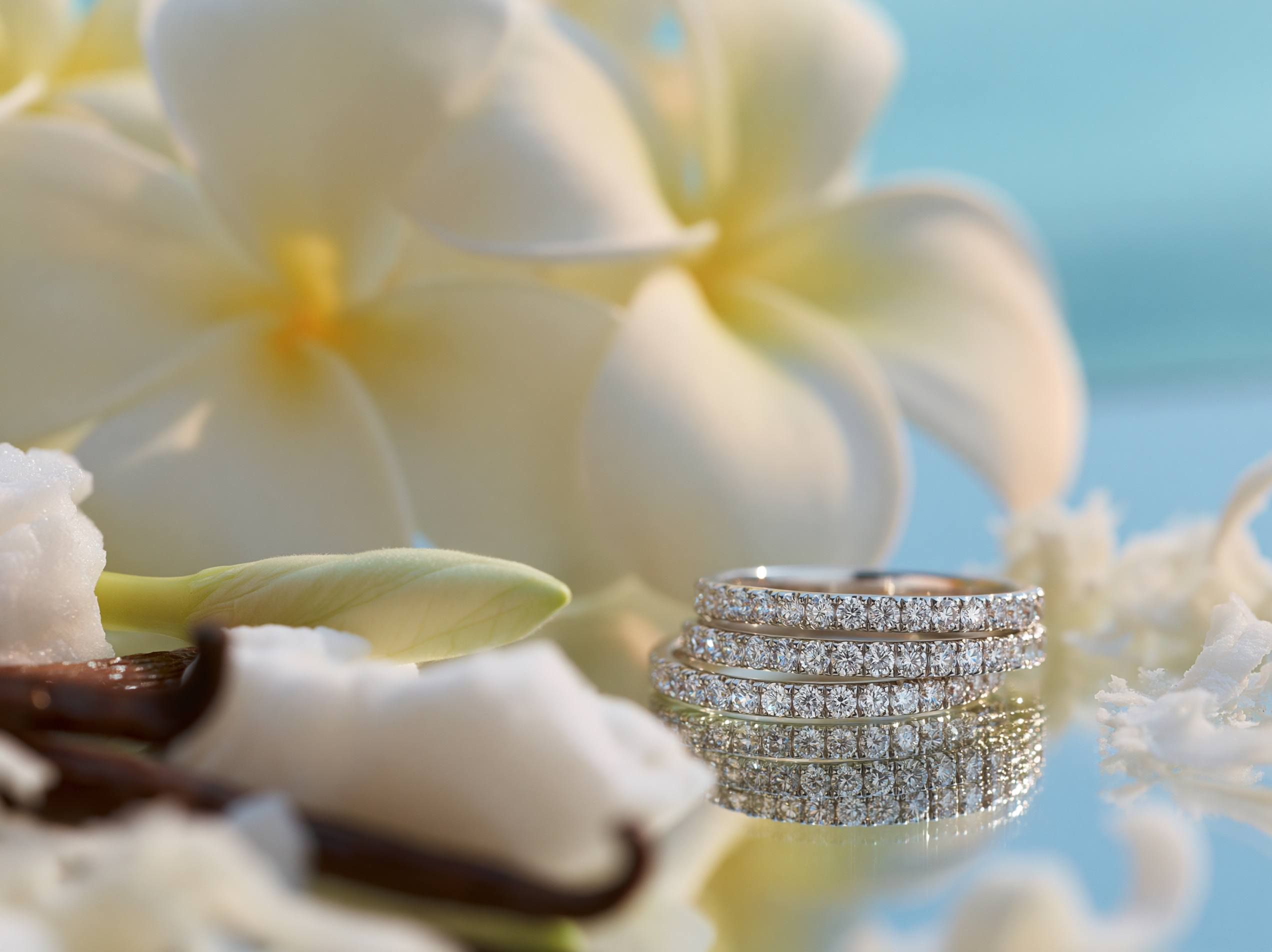 Stack of diamond rings on a floral background