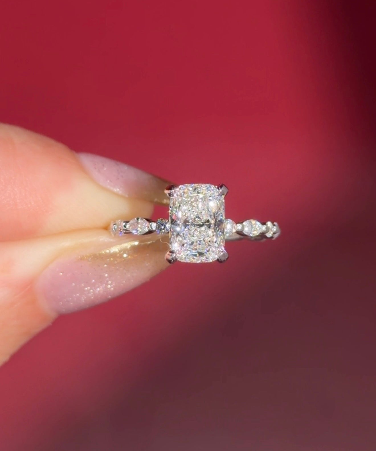 The Rei is a traditional style engagement ring featuring a hidden halo set between the prongs, adding subtle sparkle beneath the center stone.

The standout detail of this design is the floating marquise and round side diamonds, each held by a single prong. This setting allows each side diamond to be fully visible from every angle, creating a light, airy, and elegant look.

Because of this construction, Rei is a more delicate and high maintenance style, best suited for those who are mindful with daily wear 