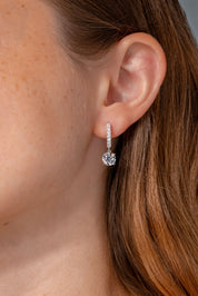 White Gold Diamond Pave Hoops with a 4 prong diamond drop on ear