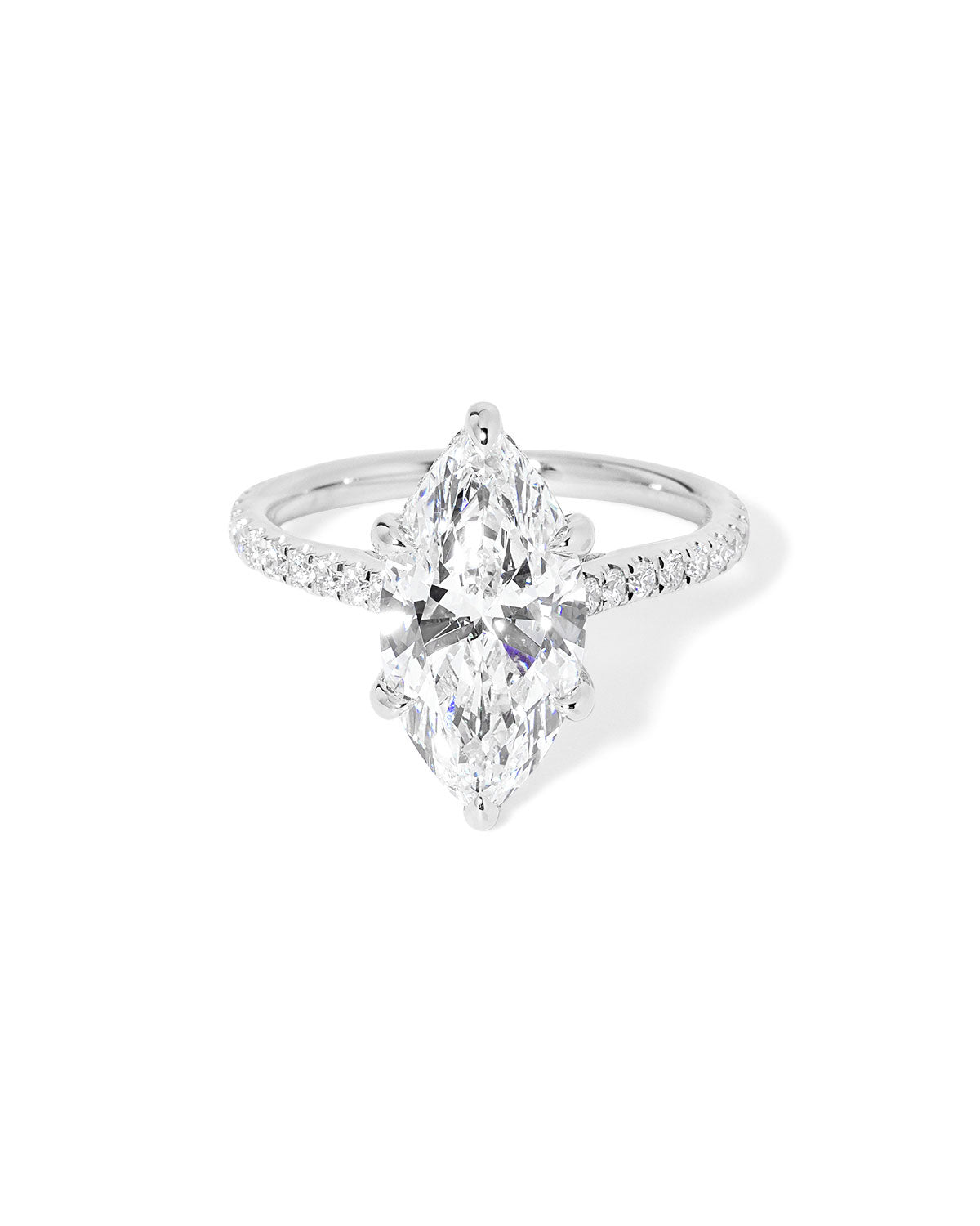 The Alice Marquise lab diamond engagement ring at Princess Bride Diamonds in Huntington Beach, California features a classic pavé diamond band with a cathedral-style setting for a higher, elegant look. It also includes a hidden under-halo beneath the center stone and a diamond bridge for added sparkle from every angle. 14k white gold 