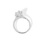 The Alice Marquise lab diamond engagement ring at Princess Bride Diamonds in Huntington Beach, California features a classic pavé diamond band with a cathedral-style setting for a higher, elegant look. It also includes a hidden under-halo beneath the center stone and a diamond bridge for added sparkle from every angle.