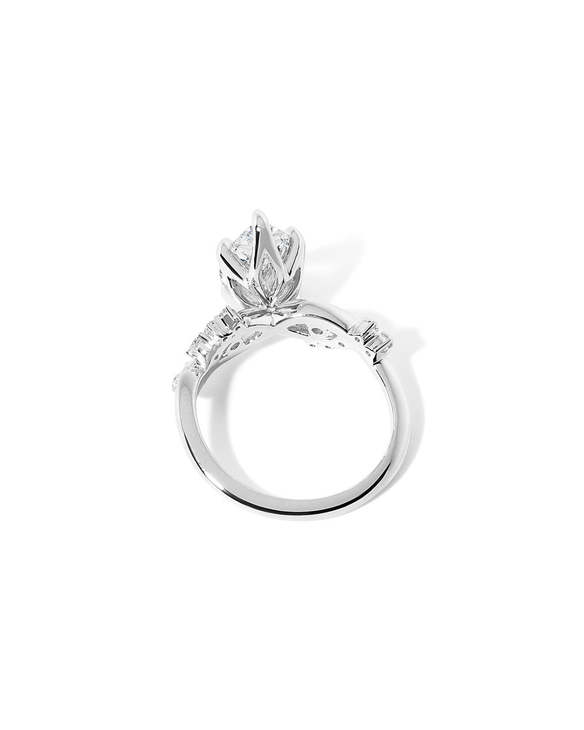 Side profile of the Ariel Pear engagement ring showing diamond bubble side stones and sculpted wave contours at Princess Bride Diamonds jewelry store in Orange County