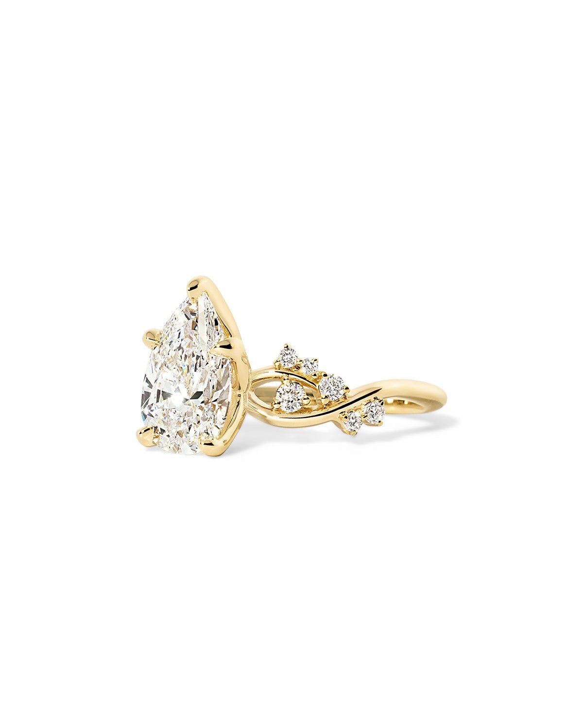 Angled view of the Ariel Pear engagement ring with ocean-inspired design and bubble diamond accents at Princess Bride Diamonds jewelry store in Orange County