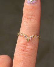 Fairy Blossom Band with pink and purple sapphires worn on the finger in 14K yellow gold