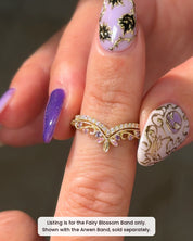 Fairy Blossom Band stacked under the Arwen Band, sold separately, in 14K yellow gold