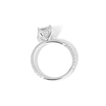 Kayla Emerald Engagement Ring with a diamond hidden halo and classic pave band featuring lab grown diamond side stones in solid yellow gold at princess bride diamonds in huntington beach california 14k white gold 