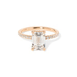 Kayla Emerald Engagement Ring with a diamond hidden halo and classic pave band featuring lab grown diamond side stones in solid yellow gold at princess bride diamonds in huntington beach california rose gold 