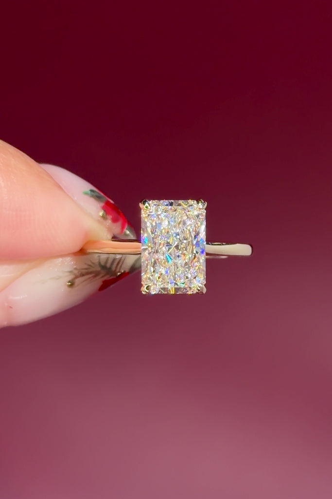 radiant lab diamond yellow gold solitaire engagement ring cathedral setting with diamond bridge