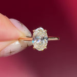 oval lab diamond yellow gold high polish engagement ring with cathedral and hidden halo