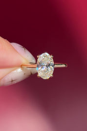 oval lab diamond yellow gold high polish engagement ring with cathedral and hidden halo