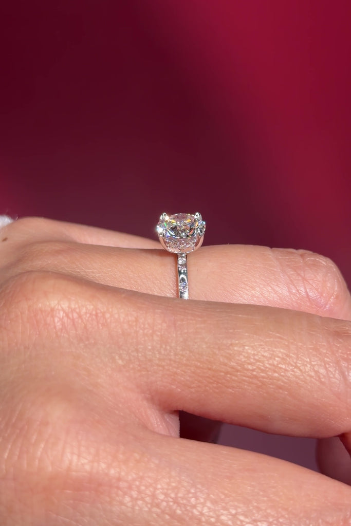 round lab diamond white gold spaced diamond inlay engagement ring on hand