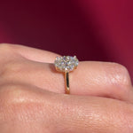 oval lab diamond yellow gold high polish engagement ring with cathedral and hidden halo on hand