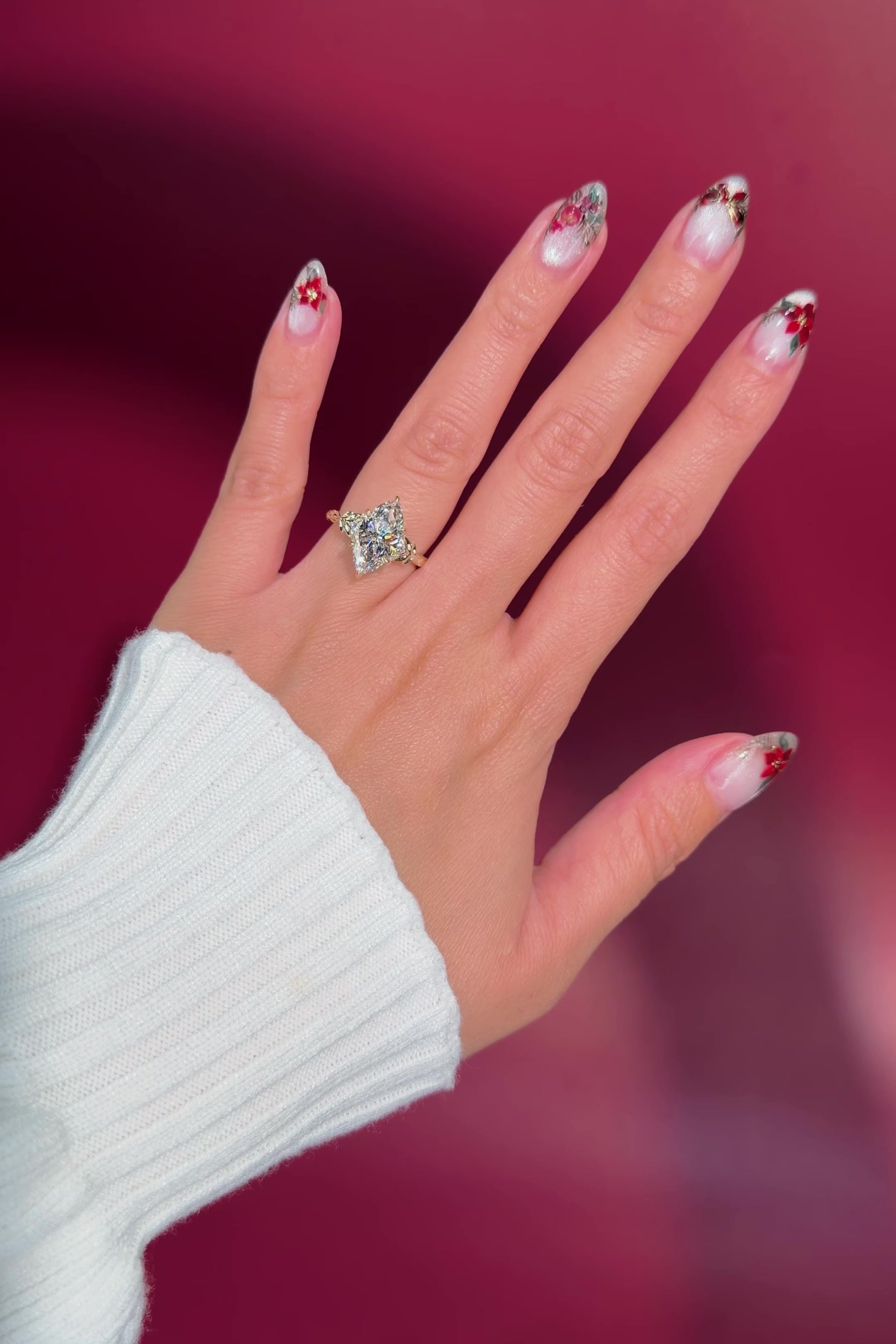 marquise diamond leafy nature inspired yellow gold engagement ring on hand