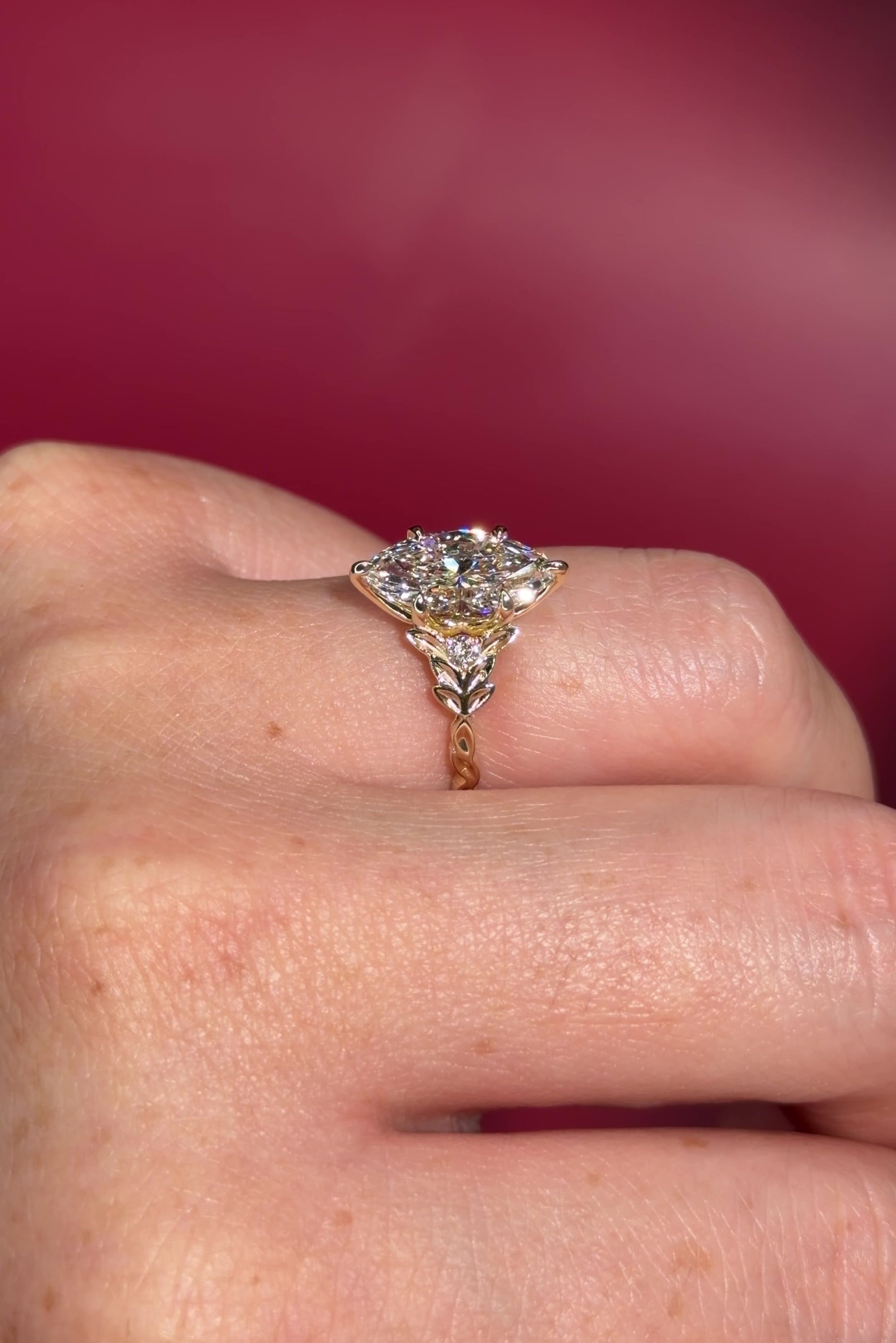 2.09ct D-VVS2 Marquise Lab Diamond Arwen. Nature inspired engagement ring with organic leaves made of gold going up the band to hold the center stone with petal prongs.
