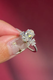 oval lab diamond engagement ring white gold side stones nature inspired cluster style