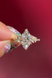marquise lab diamond cluster side stone nature inspired engagement ring yellow gold setting