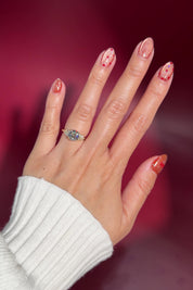 2.05ct round lab diamond engagement ring 4 prong whimsical side diamond cluster nature inspired yellow gold with petal prong basket on hand