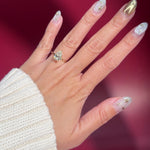 pear lab diamond solitaire engagement ring with flower petal prong basket yellow gold on hand