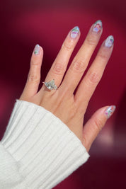 pear lab diamond nova engagement ring cluster side stones nature inspired white gold flower petal prong basket on hand