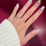 oval lab diamond yellow gold high polish engagement ring with cathedral and hidden halo on hand