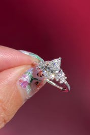 pear lab diamond cluster white gold nature inspired engagement ring with petal prong basket